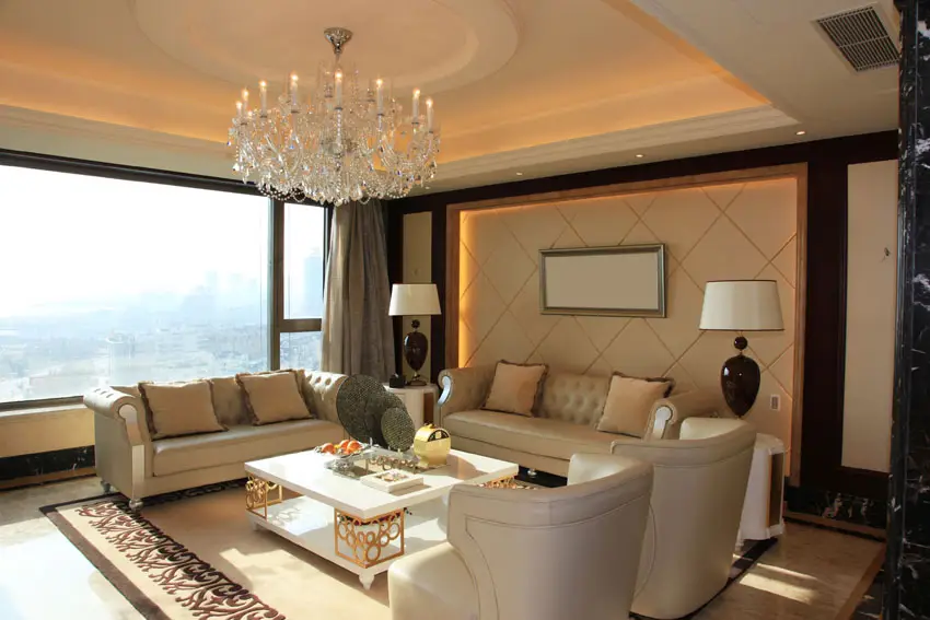 Wide windows, quilted sofa and recessed lighting