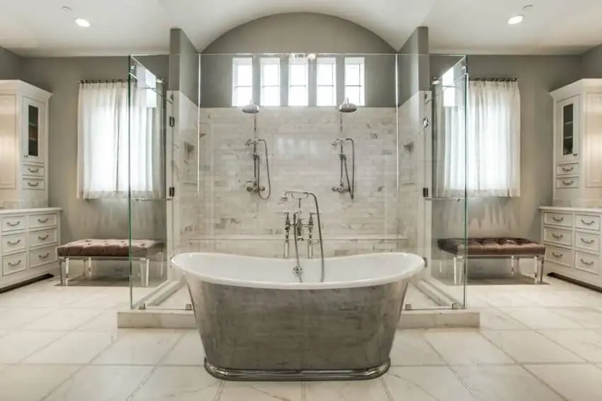 Bathroom with large shower, cast iron bathtub and marble floors