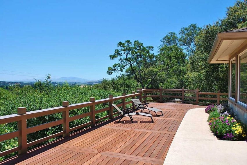 Beautiful wood deck with hillside views next to flower planter