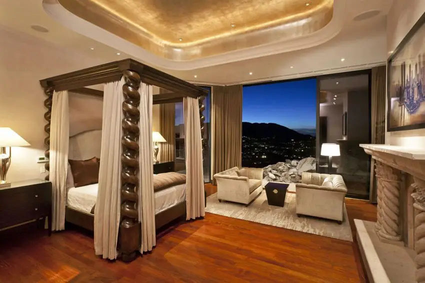 Bedroom with custom four post bed Brazilian cherry wood floors and stunning city views
