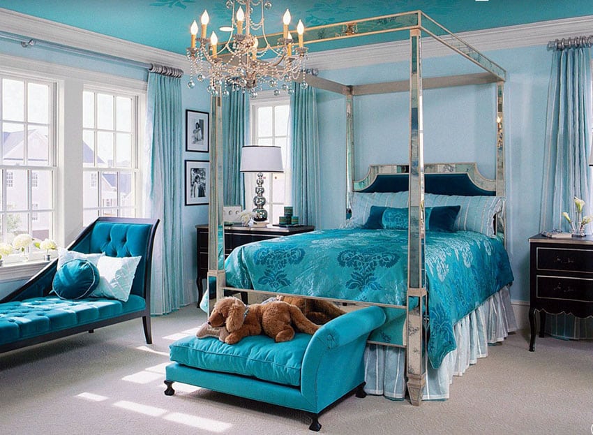 Teal master bedroom with four post bed and white molding