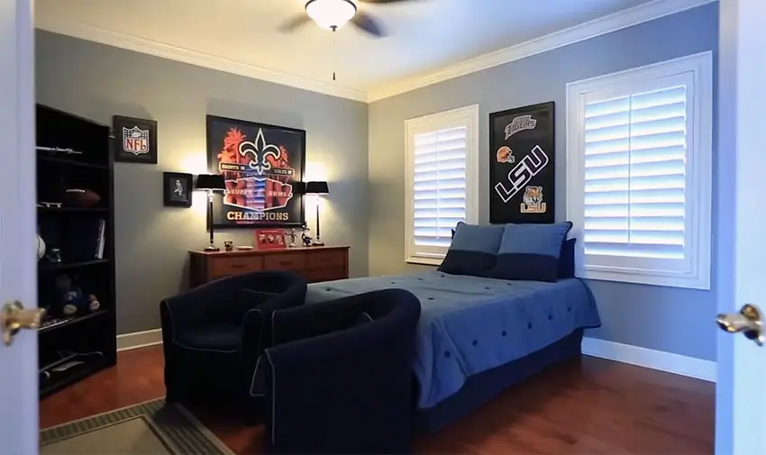 Boys blue bedroom with sports posters