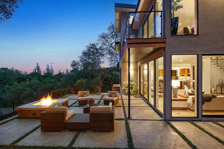 Concrete slab patio with fire pit and hill side views