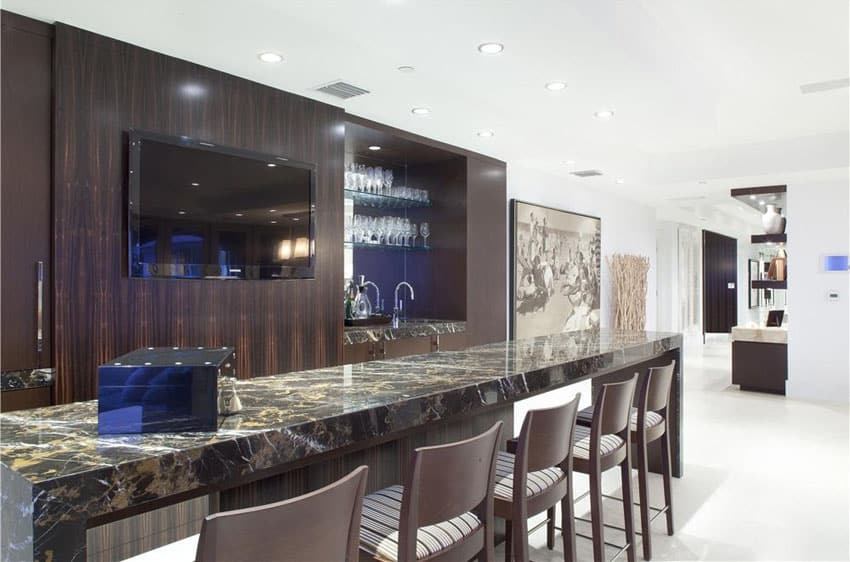 Bar with dark marble countertops and white ceiling