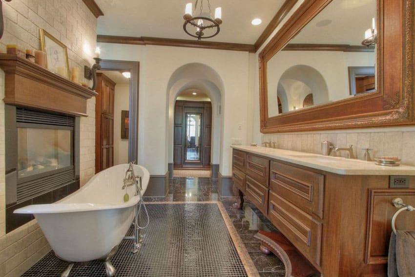 Contemporary bathroom with cast iron clawfoot tub and fireplace