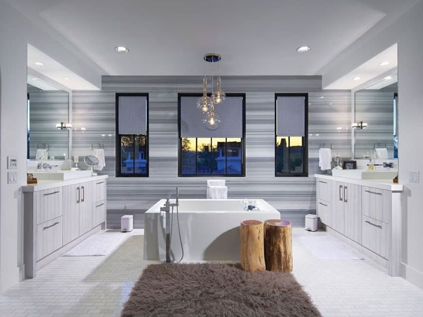 Bathroom with freestanding tub and bubble pendant lights