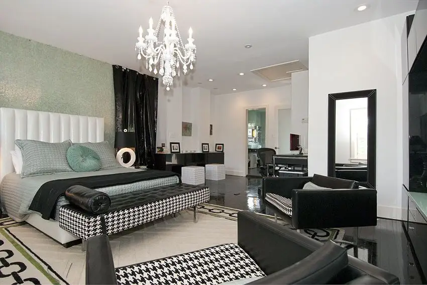 Contemporary bedroom with mosaic accent wall and black and white decor
