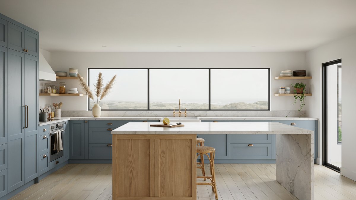 Coastal kitchen with blue gray shaker cabinets, white oak island and a wide dune view window