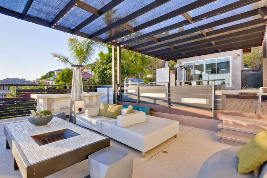 Lounge beds and shaded pergola in a multilevel patio space