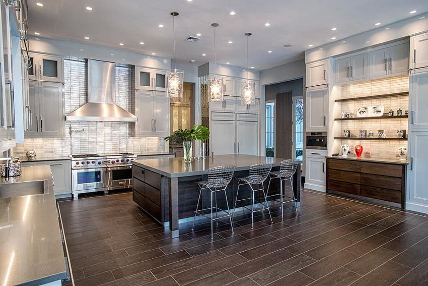 Kitchen with stainless steel counters and glazed porcelain tile flooring