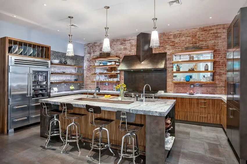 Contemporary kitchen with brick wall and marble countertop island