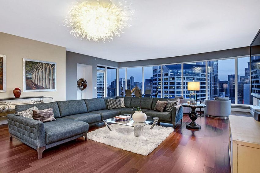 Contemporary living room with chihuly inspired light fixture and city views