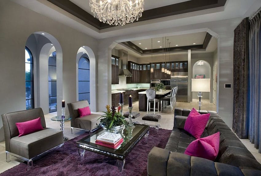 Purple rug, grey chairs and brocade curtains