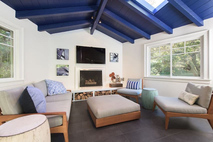 Contemporary living room with painted blue wood plank ceiling