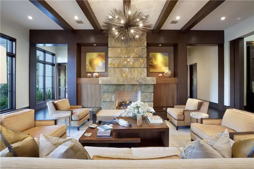 Contemporary living room with tan furniture and modern pointed chandelier