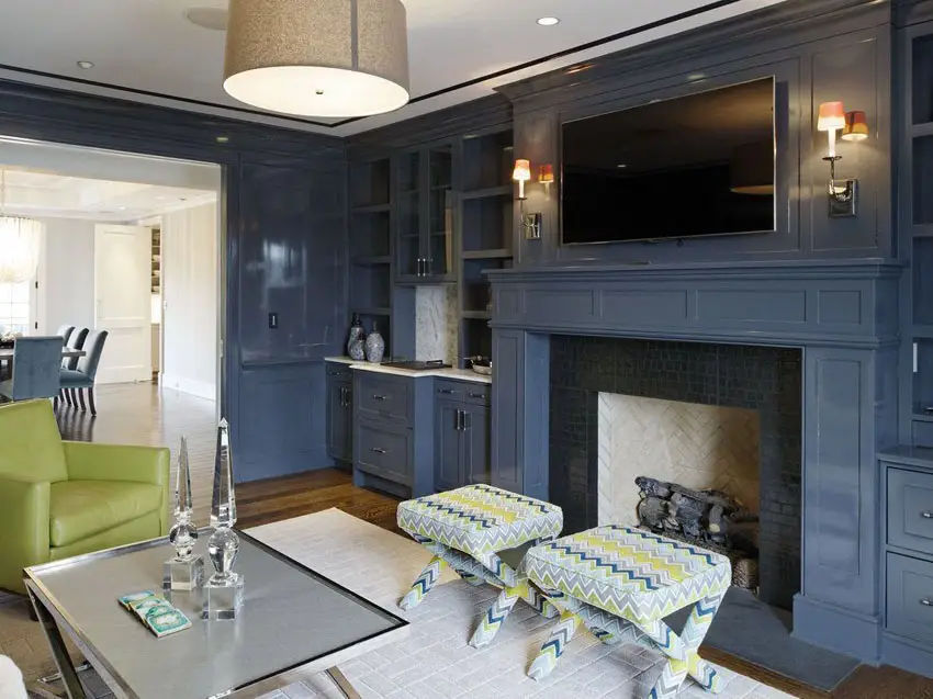 Contemporary living room with wainscoting and painted blue fireplace