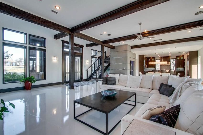 Contemporary living room with white furniture and exposed beam ceiling