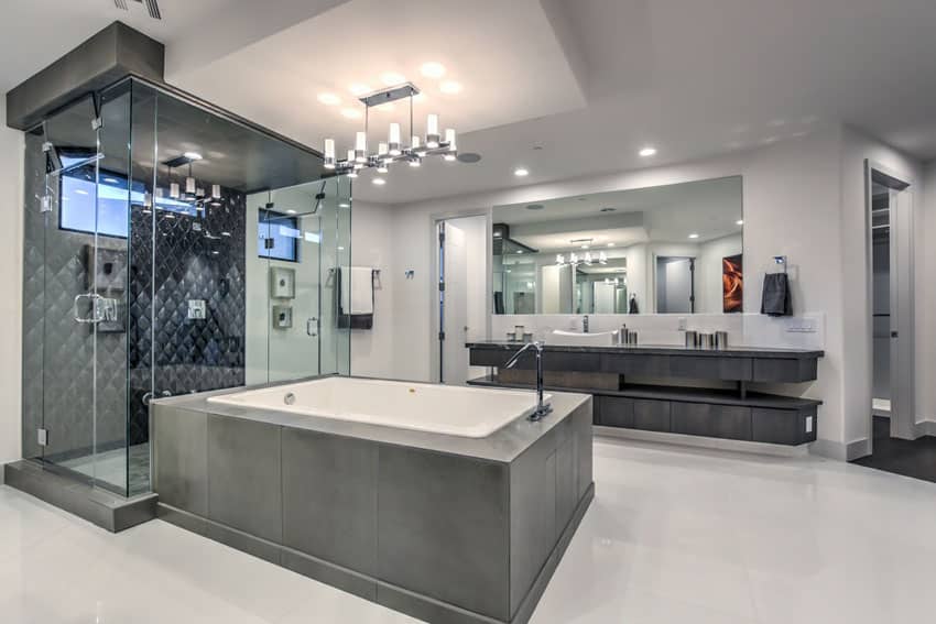 Bathroom with enclosed shower area with gray tiles