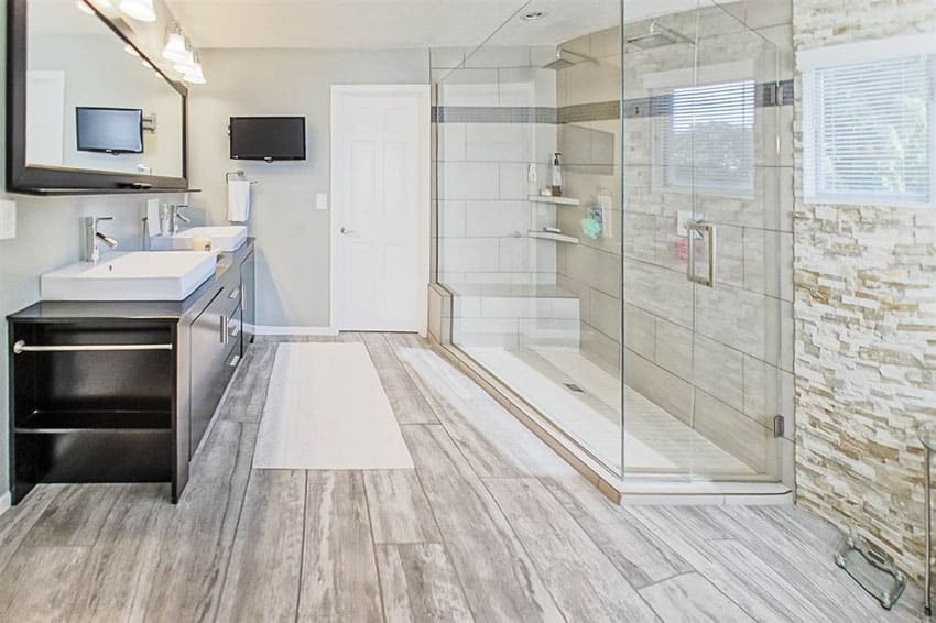 Bathroom wood like tile made of porcelain and glass enclosed shower