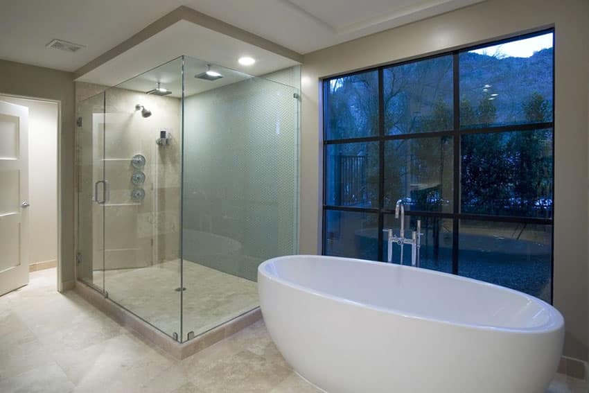 Contemporary master bathroom with rain shower with mountain views and marble slab tile