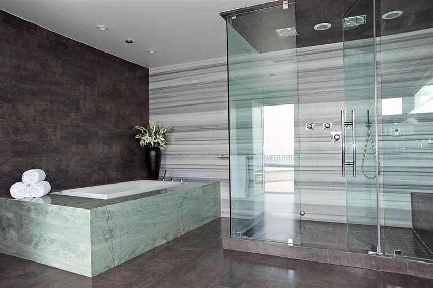 Contemporary master bathroom with soapstone bathtub enclosure and porcelain walls