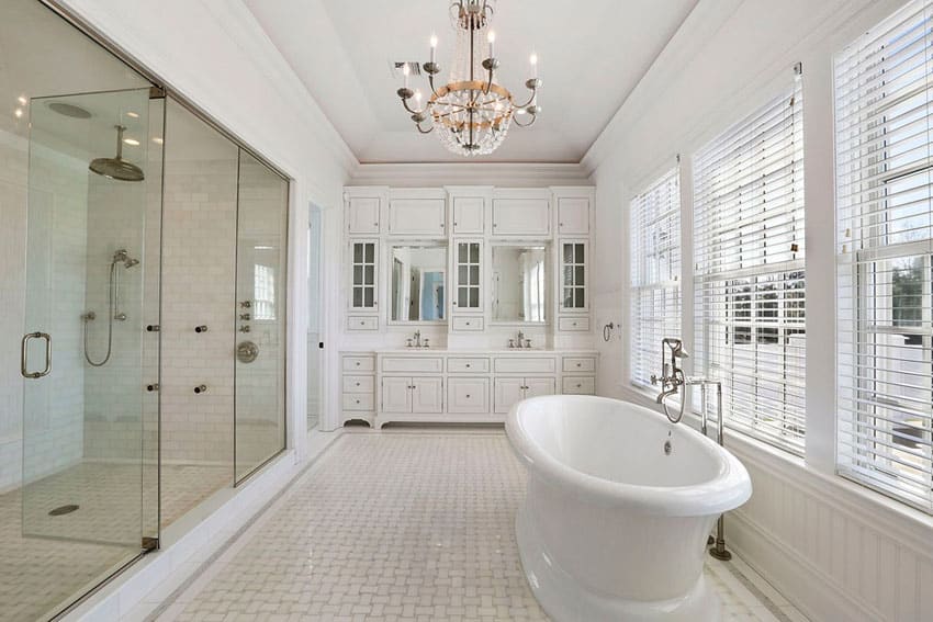 Cottage master bathroom with white vanity subway tile and rain shower