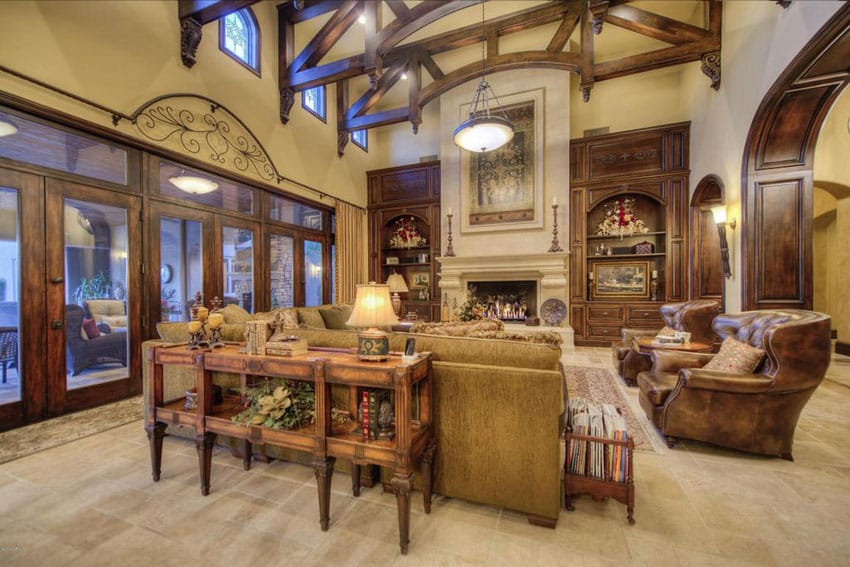 Craftsman living room with luxury furnishings and high vaulted ceiling with wood beams