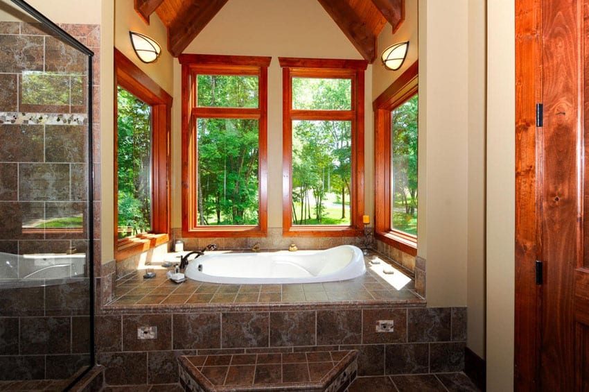 Craftsman master bath with elevated bathtub with outdoor views