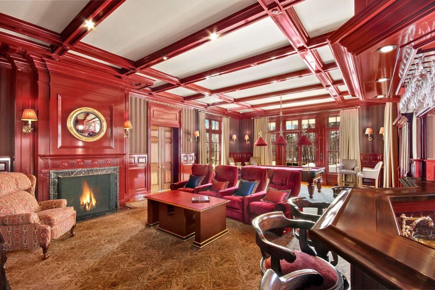 Custom cherry wood living room with decorative woodwork and home bar