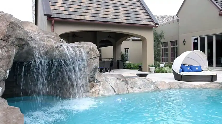 Custom pool with swimming grotto and waterfall