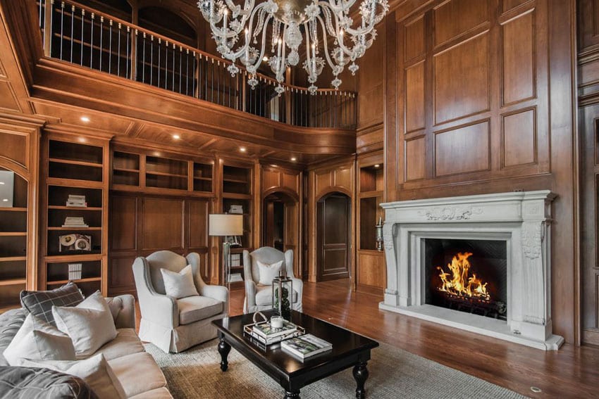 Custom wood room with decorative custom fireplace and glass chandelier
