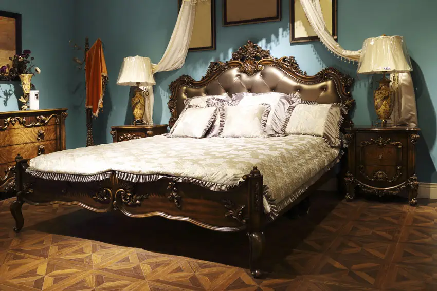 Elegant bedroom with parquet flooring and blue color walls