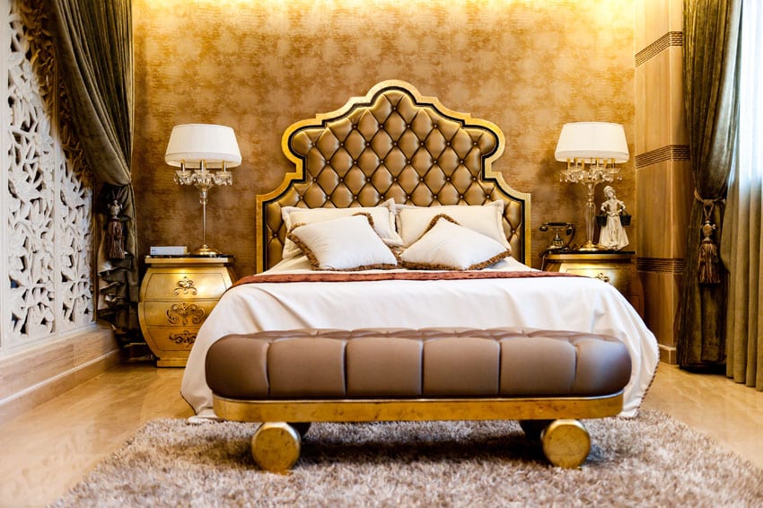 Elegant gold theme bedroom with plush headboard