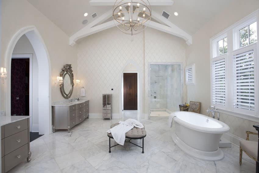 Elegant master bathroom with glazed porcelain floors and oval bathtub