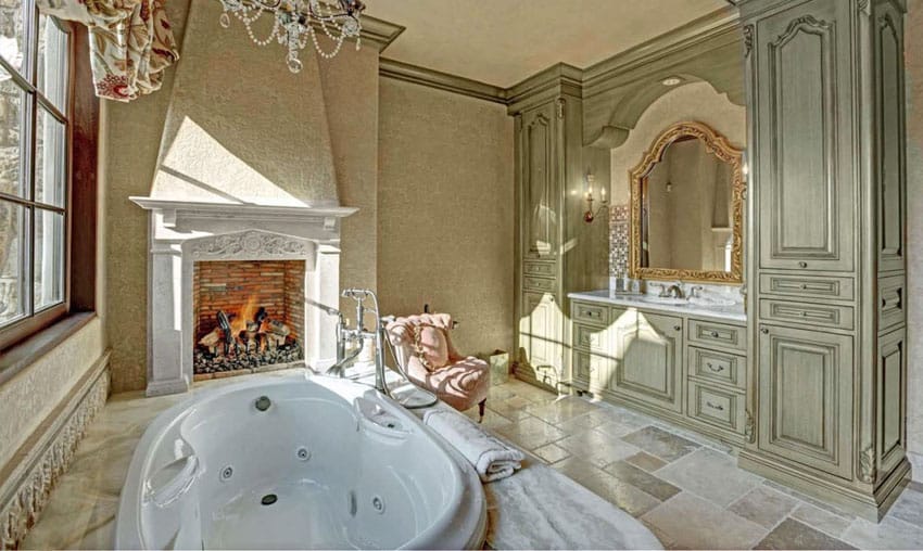 Elegant master bathroom with large jet bathtub and fireplace