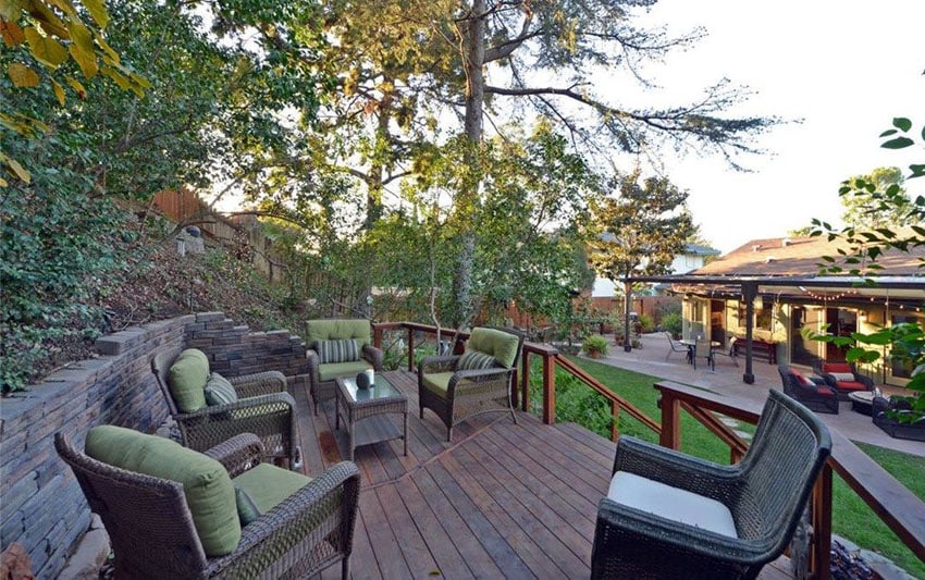 Elevated wood deck on hill in the backyard