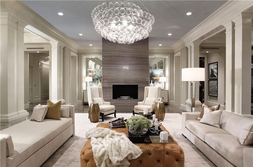 Brown leather ottoman, crystal chandelier and backless sofa