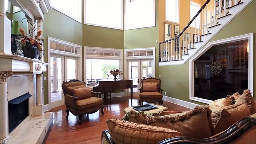Formal living room with hardwood floors and brown grand piano