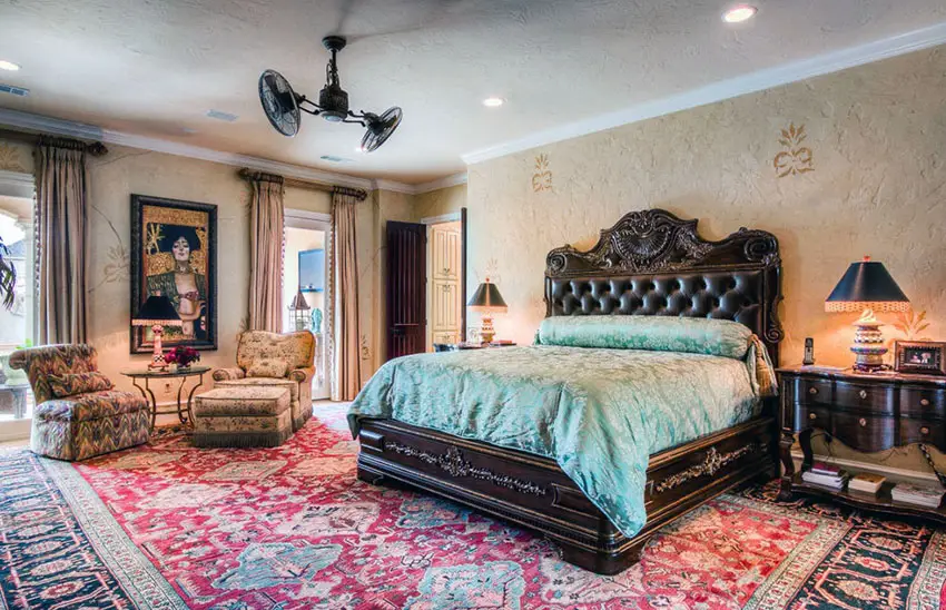 Glamorous luxury bedroom with artful splashes of color and patterns and dark brown bed frame