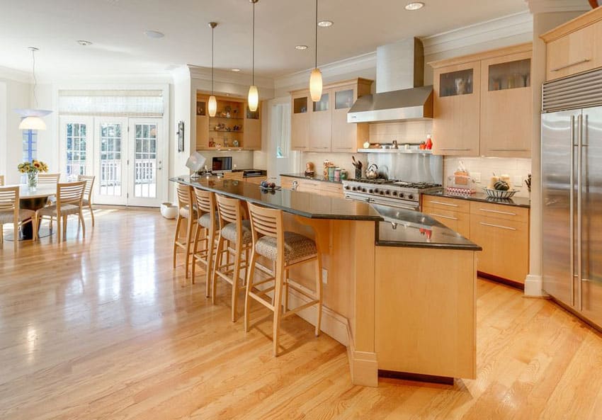 Kitchen with absolute black counter and honey color engineered hardwood floor