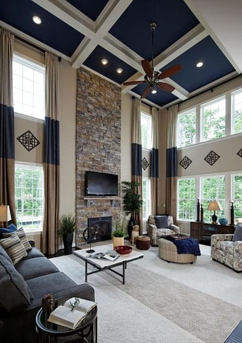 Living room with high ceiling painted blue and white