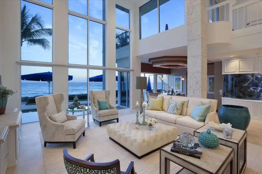 Room with high walls with glass panels and limestone flooring