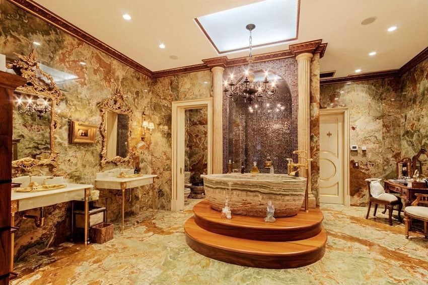 Luxury bathroom with natural stone bathtub quartz floor tiles and granite walls