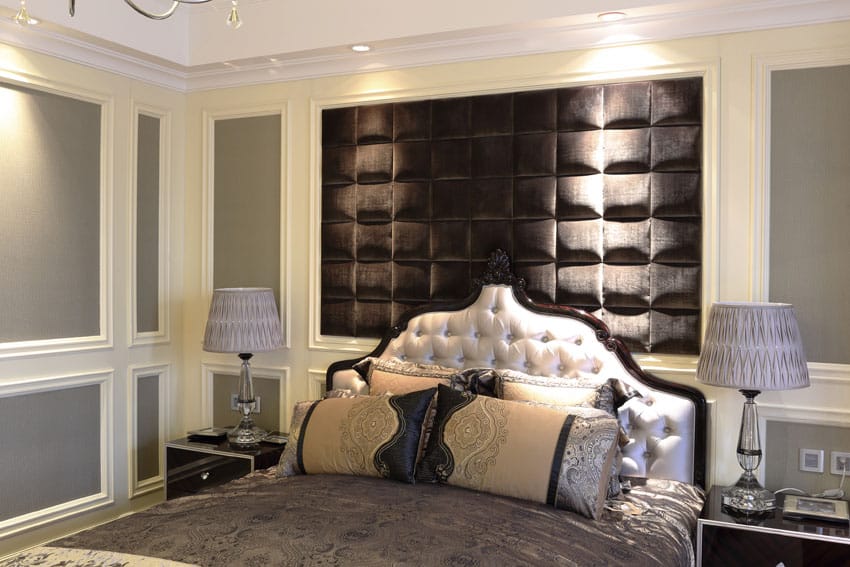 Luxury bedroom with white molding and accent wall