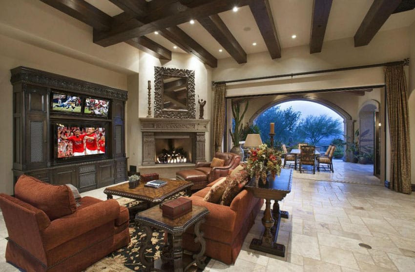 Luxury craftsman living room with arched outdoor view and cement fireplace