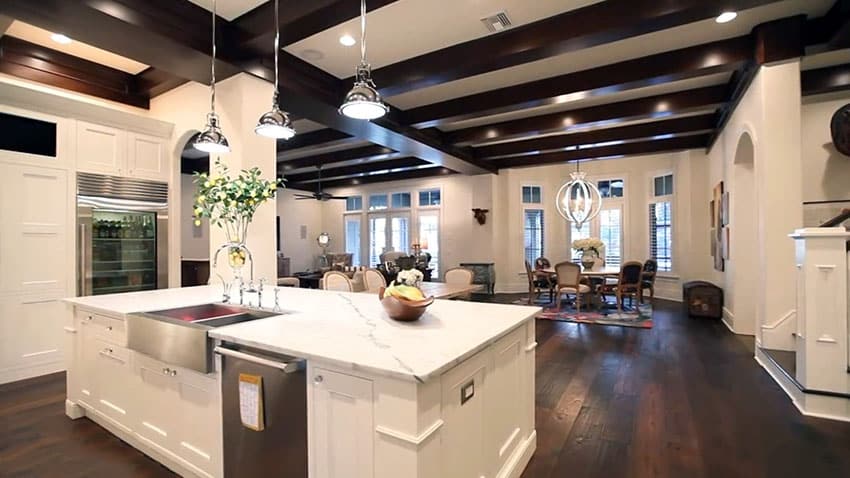 Luxury kitchen with white cabinet island marble counter and dark hardwood floors