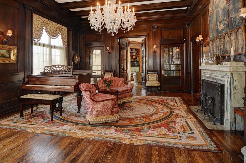 Luxury living room with elegant furnishings decorative fireplace and custom woodwork paneling