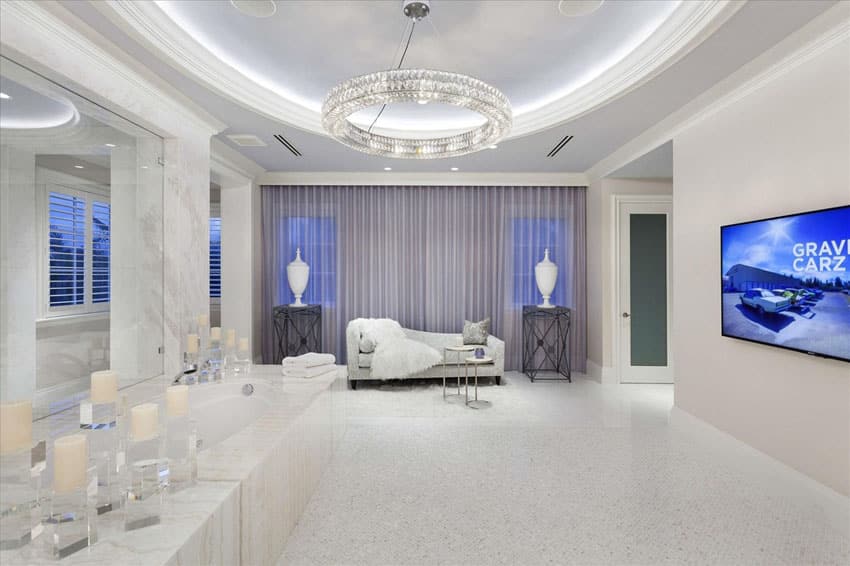 Luxury bathroom with round illuminated ceiling with modern circular light and daybed