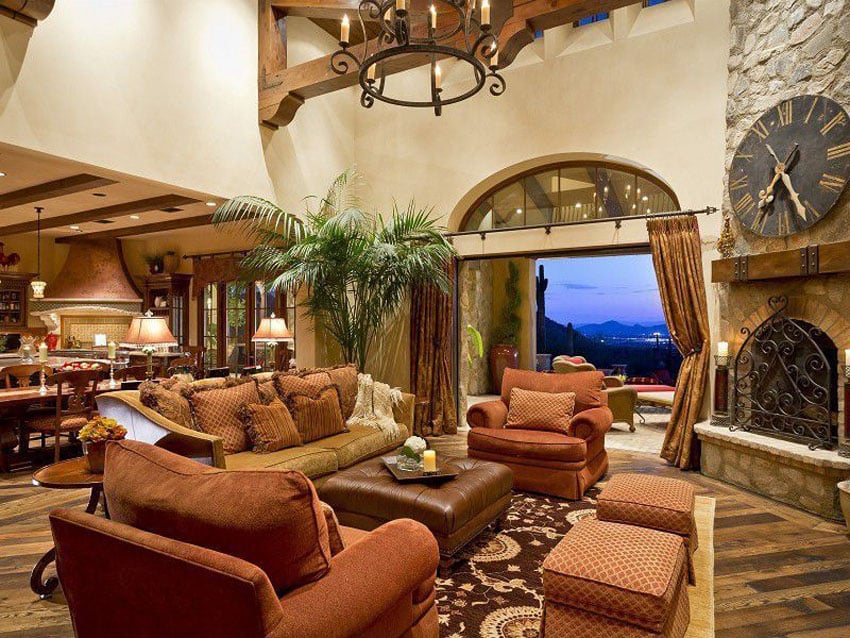 Luxury Mediterranean style living room with stone fireplace and amazing views