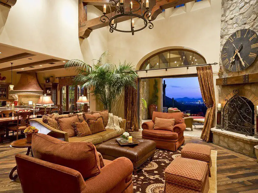 Room with stone fireplace, large doorway and traditional cabriole sofa
